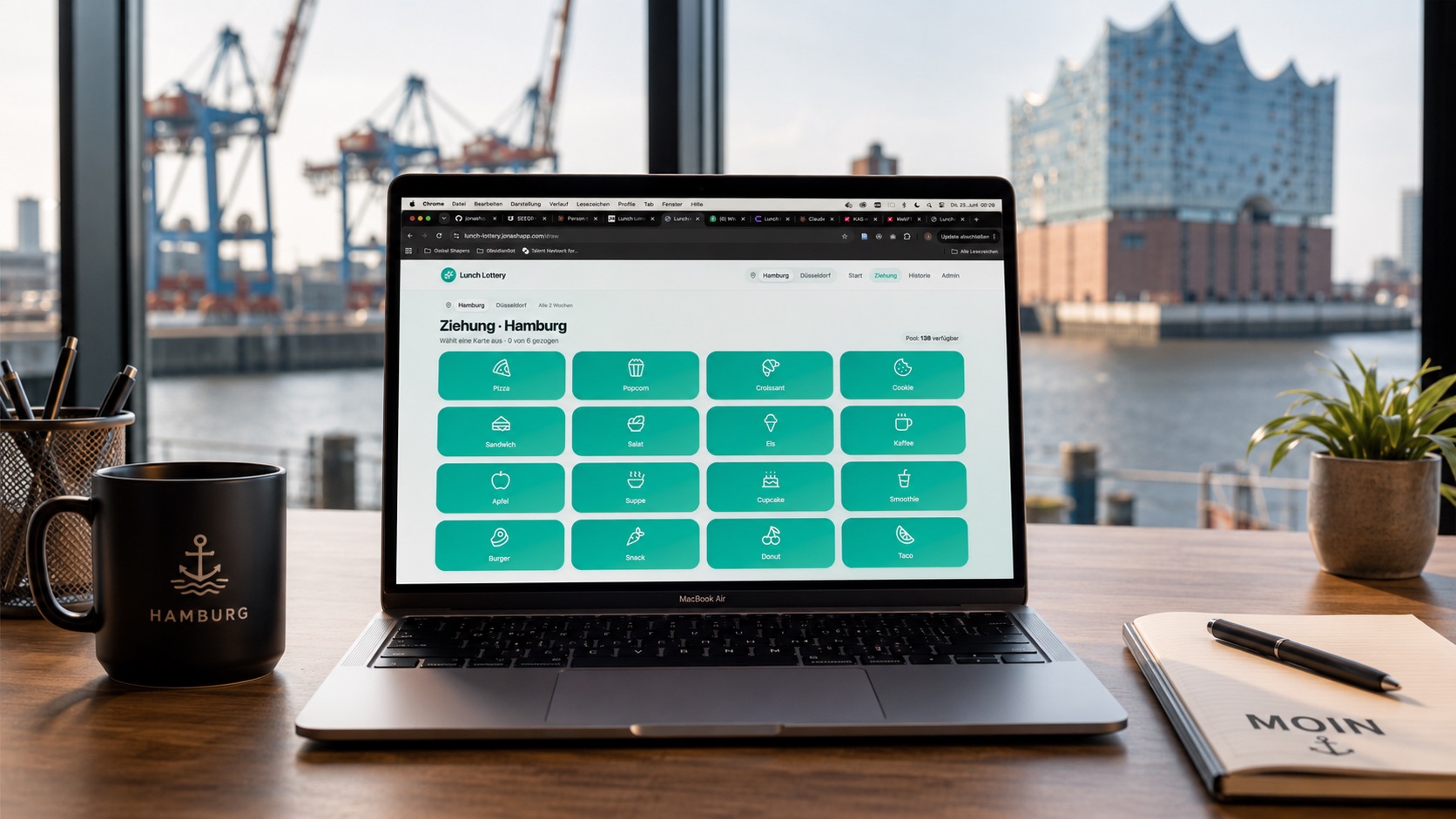 Lunch Lottery app shown on a laptop in a Hamburg harbour office